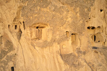 Amazing Volcanic Rock Formations At Cappadocia, Turkey. Close Up Ancient Cave Dwellings Carved In Stone.