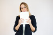 © Danko - Joyful businesswoman holding a tablet in her hands