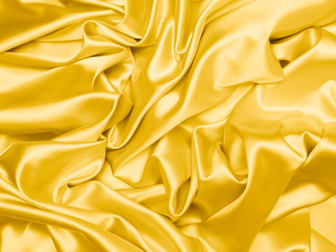 Wall Mural - Beautiful smooth elegant wavy light yellow satin silk luxury cloth fabric texture, abstract background design. Copy space. 
