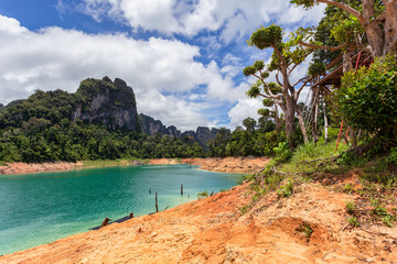 Wall Mural - Beautiful mountains lake river sky and natural attractions in Ratchaprapha Dam at Khao Sok National Park, Surat Thani Province, Thailand.