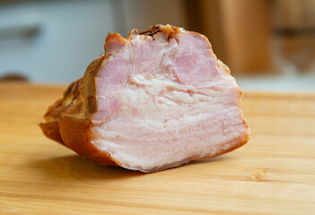 Smoked pork meat on kitchen table.