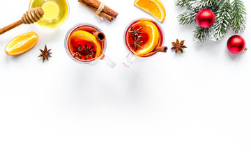 Christmas mulled wine with ingredients and Christmas decoration