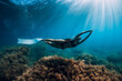 © artifirsov - Freediver woman with white fins glides over seaweed bottom with sun rays. Freediving underwater in sea