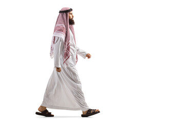 Sticker - Full length profile shot of an arab man in a traditional thobe walking