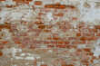 © Oksana - Red Old Weathered Brick Wall With Beaten Pieces Of Whitewash, Putty And Plaster
