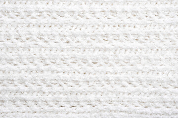 White knitted texture and background, close up.