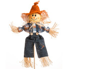 Straw Scarecrow Doll In Jean Denim And Plaid Flannel Shirt. Autumn Decorations. Country Style. Isolated White Background.