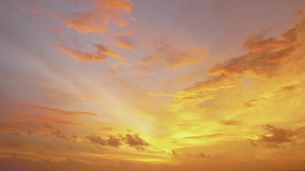 Wall Mural - Nature video Time lapse video. Scene of Colorful amazing sunset Golden sky to Red sky Day to Night with Moving clouds background in nature and travel concept.