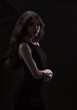 © Антон Фрунзе - Silhouette of a beautiful, slender brunette in a black dress