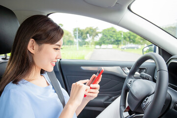 Wall Mural - woman use phone in car