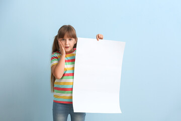 Sticker - Surprised little girl with blank paper sheet on color background