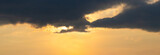 Fototapeta Na sufit - Panorama of dramatic sky with dark cloud at sunset