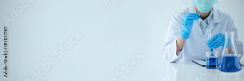 Fotomural Scientists concentrate at result of chemistry experiment on empty background
