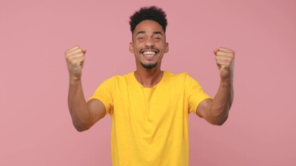 Sticker - Happy young african american man in yellow t-shirt posing isolated on pink background in studio. People lifestyle concept. Countdown 1 2 3 one two three go celebrate win scream doing winner gesture