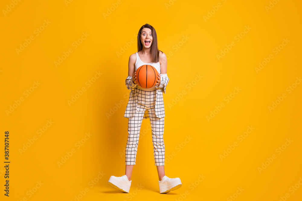 Full size photo of crazy nice girl hold ball dress tank-top costume sneakers isolated on yellow background - obrazy, fototapety, plakaty 