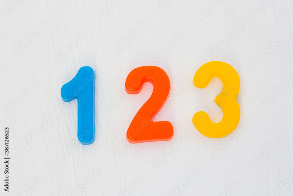 One Two Three Color Colorful plastic numeral one, two, three on white background. Learning ...