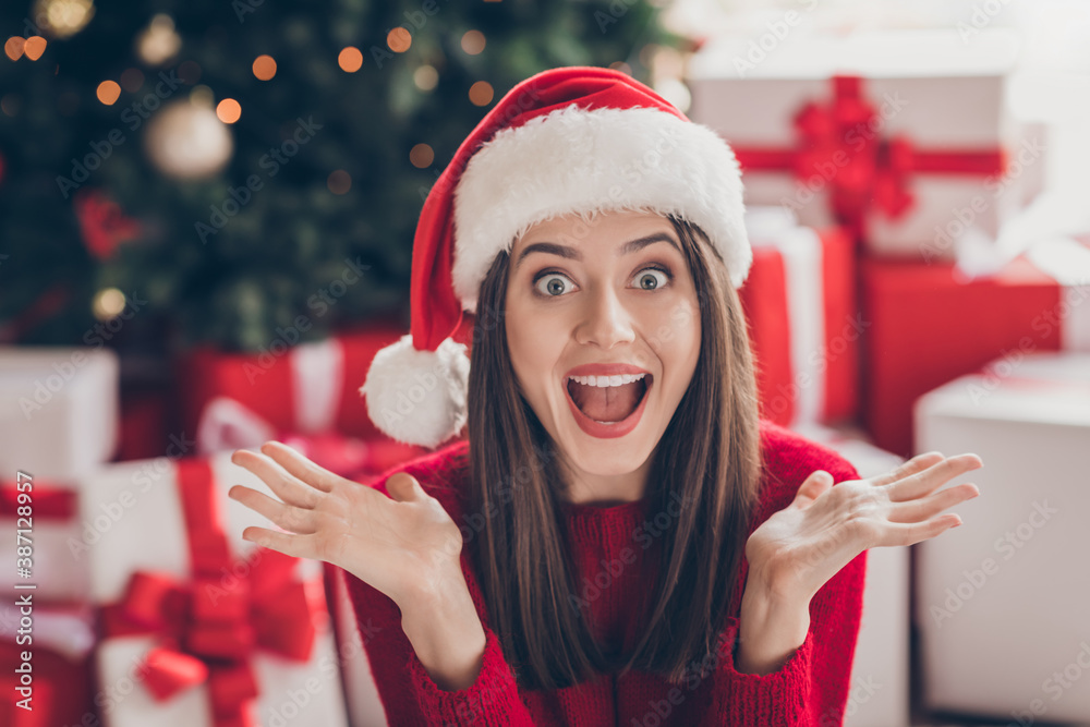 Photo of shocked young girl gifts hands open mouth staring wear santa headwear red sweater in decorated x-mas living room indoors - obrazy, fototapety, plakaty 