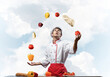 © adam121 - Young male chef juggles with food ingredients