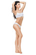© Anatoly Repin - Fitness young woman with a beautiful body on white background