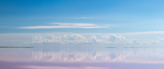  Pink salt lake water with clouds and blue sky