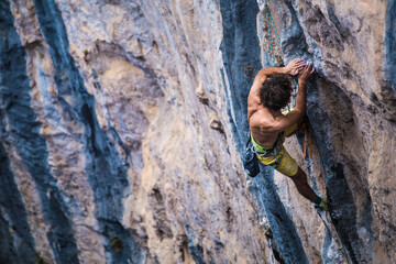 A strong man climbs a rock, Rock climbing in Turkey.