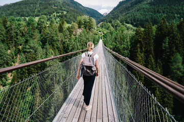 Bridge through green forest in summer