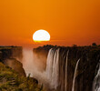 Supersized sun over Victoria Falls in Zambia