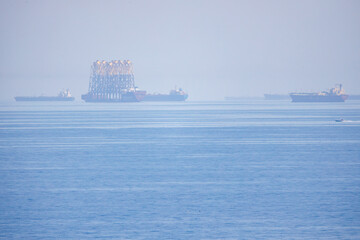 Logistics and transportation of International Container Cargo ship in the ocean at sun rise. Freight Transportation and Shipping