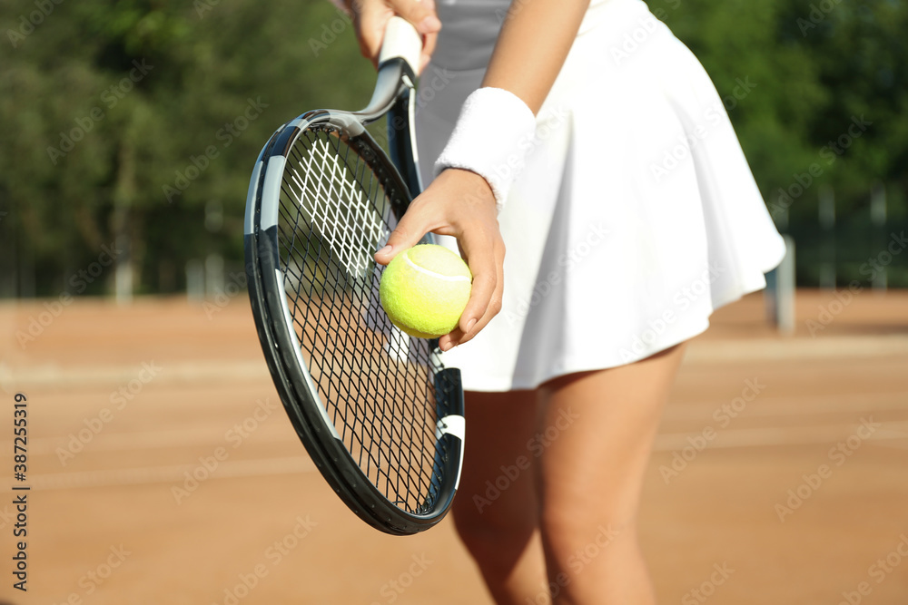 Sportswoman preparing to serve tennis ball at court, closeup - obrazy, fototapety, plakaty 