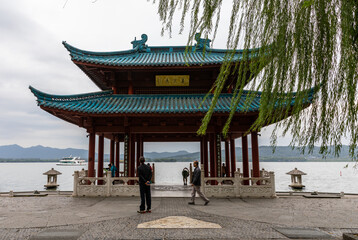 Cuiguang Pavilion of traditional Chinese style by West Lake or Xihu, Hangzhou, Zhejiang, China. Place for a break or relaxation. Former site of imperial marina.