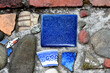 Repurposed tiles, broken dishes and pebbles form artistic mosaic walkway