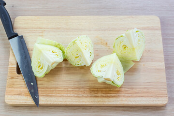 Wall Mural - cabbage and cutted cabbage on wooden