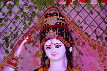 Wall Mural - Closeup of face of Goddess Durga, Idol of goddess Durga, hindu festival navratri.