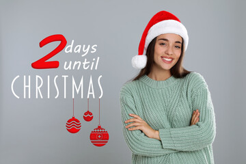 Christmas countdown. Happy woman wearing Santa hat on light grey background near text