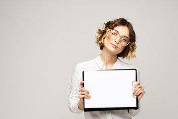 Business woman with a folder of documents on a light background cropped view and shirt suit