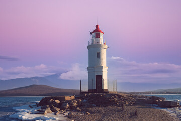 Canvas Print - Seascape overlooking The Tokarev lighthouse against the pink sky.