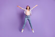 © deagreez - Full length photo portrait of sweet charming brown hair girl wear retro plaid shirt jumping isolated purple color background