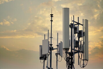 4G and 5G cellular. Macro Base Station or Base Transceiver Station. Telecommunication tower. Wireless Communication Antenna Transmitter. Development of communication systems in urban area at sunset.