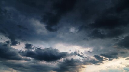 Wall Mural - beautiful dark dramatic sky with stormy clouds time lapse