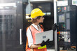 © NVB Stocker - Manufacturing Factory female Mechanical Engineer Works on Personal Computer at industrial factory