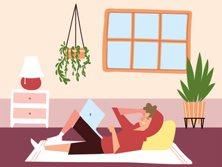 Canvas Print - freelancer working on laptop lying in the room, indoor activities