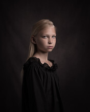 Renaissance Portrait Of A Blonde Girl In Black Dress In Dark Painterly Rembrandt Art Style