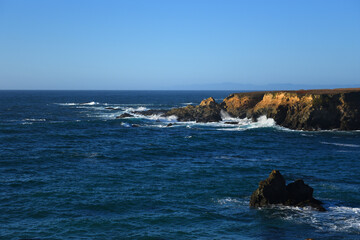 Wall Mural - beach with turquoise ocean water on rocky coast