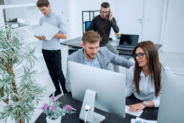 Wall Mural - group of employees works in a modern office.