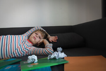 Wall Mural - Child tired and bored of learning and doing homework