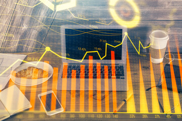 Multi exposure of graph and financial info and work space with computer background. Concept of international online trading.