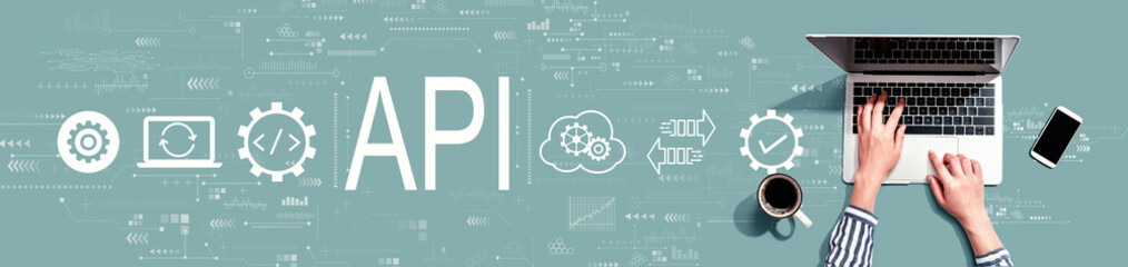 API - application programming interface concept with person using a laptop computer