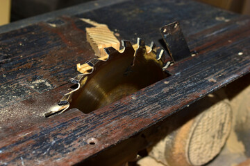 Rusty circular saw close up in the garage