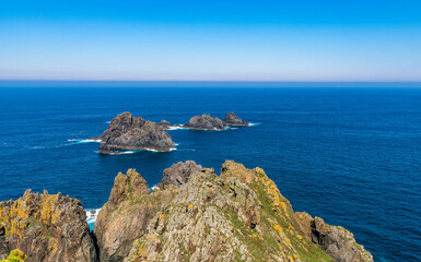 Wall Mural - View of Aguillons rocks or islands emerging from the ocean at Cape Ortegal in the Galicia region of Spain.