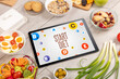 © ra2 studio - Healthy Tablet Pc compostion with START DIET inscription, weight loss concept